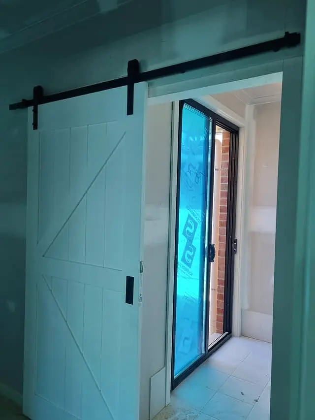 The completed internal barn-style sliding door on its track