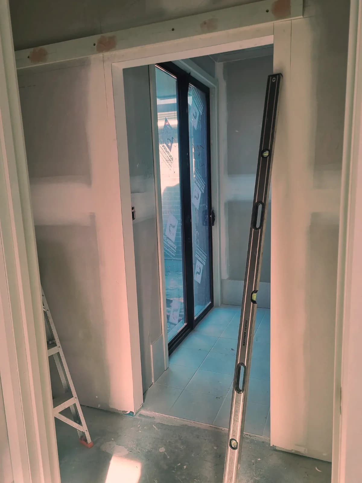 An internal sliding door opening being installed