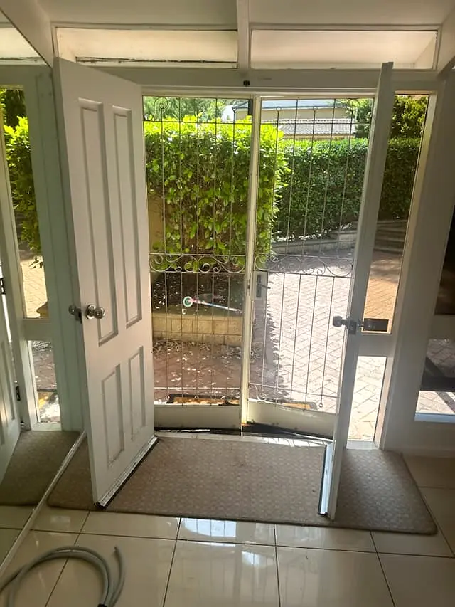 The original entry doorway before the new timber door