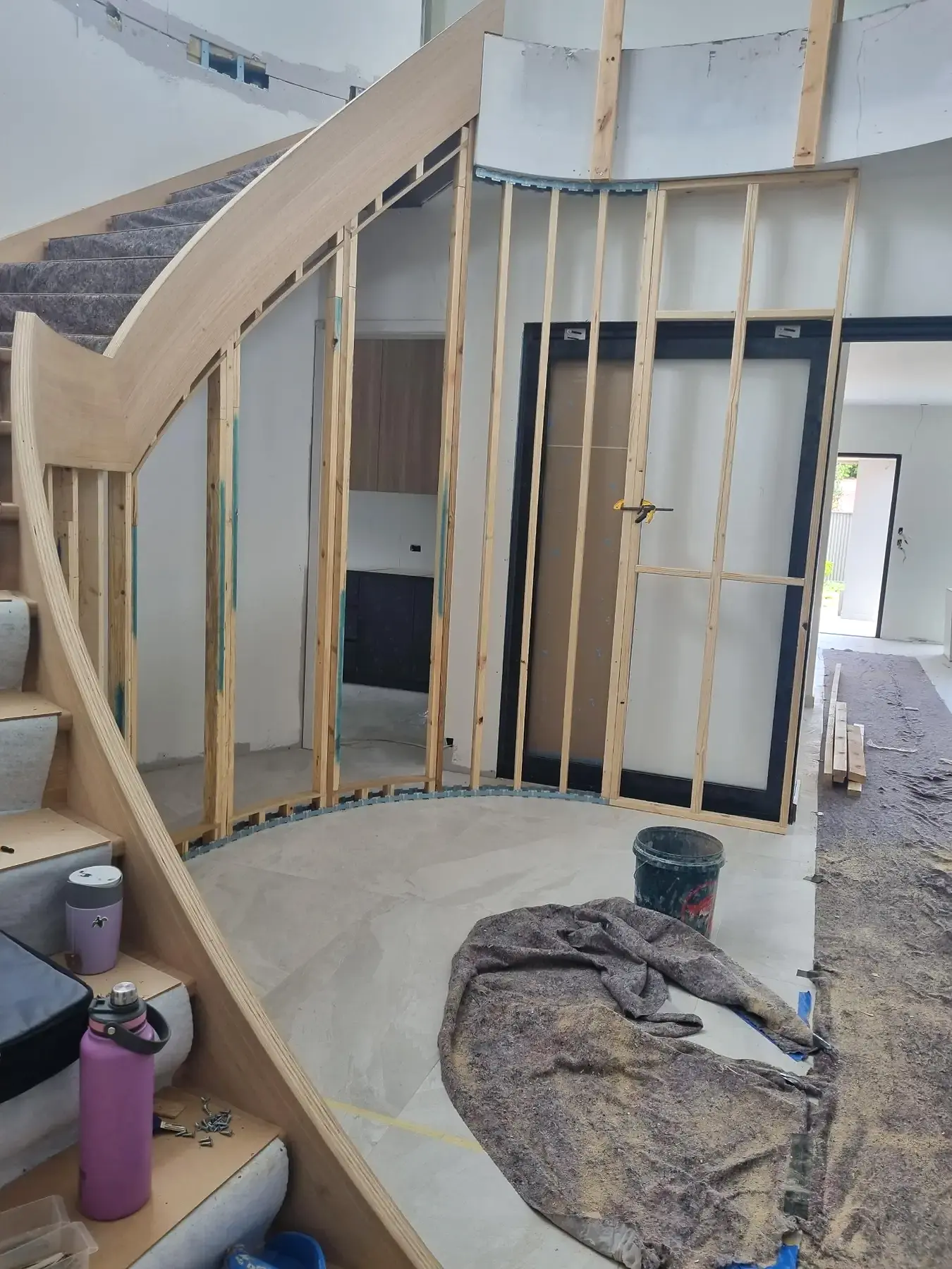 Curved stair wall framing by Maiden Built Carpentry